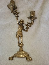 bougeoir en bronze porté par