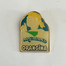 102 - Pin's ORANGINA AQUALAND signé PUB GARCIN