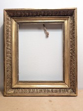 Trés beau cadre  bois doré Empire à palmettes