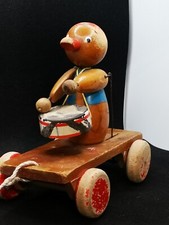 jouet ancien automate à tirer le Canard. musicien tambour vers 1960 en bois. 