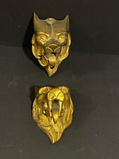 Paire objets heurtoirs? bronze doré style Art Déco tête de fauve sculpture félin