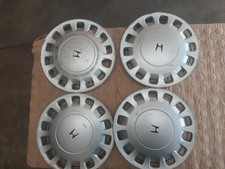 LOT DE 4 ENJOLIVEURS D`ORIGINE HONDA CONCERTO JANTE 14