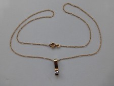 collier neuf plaqué or jaune poinçons 2.07gr  : chaine 55cm, coeur 1,4x1,2cm