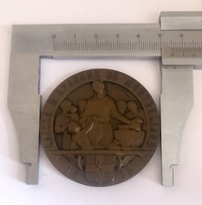 MÉDAILLE EN BRONZE CAISSE D
