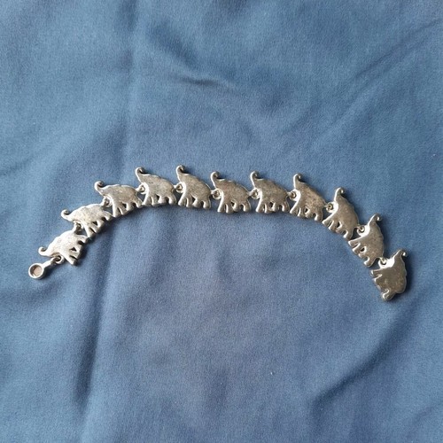 Silver toned elephant trunks - toned,