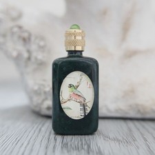 Miniature vide, bouteille en verre marbrée vert décoré d'un oiseau