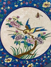Grand plat circulaire en faïence de la Louvière à décor d'oiseau style Longwy