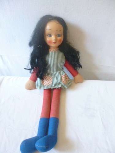 Poupée ancienne brune visage