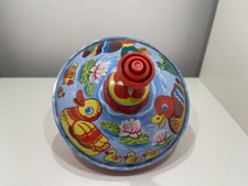 Jouet en tôle toupie 14,5 cm