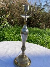 Ancien porte-flambeau en métal argenté.