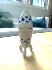 Ancien flacon bouteille en grès en forme de fusée Tintin publicitaire ? Lustucru