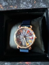 NEUVE TRS JOLIE MONTRE GUITARES CADRAN DORÉ BRACELET BLEU FEMME FONCTIONNE