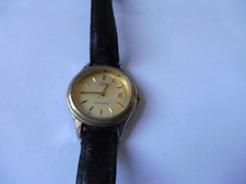 montre femme citizen avec calendrier - pile à remplacer