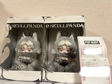 Pendentif poupée en peluche