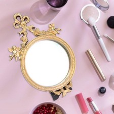 Miroir décoratif rond en or