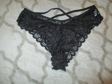 tanga noir dentelle femme bon état