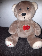 OD/ Doudou ours NOCIBE 2018 beige coeur rouge Nocibé 21 cm assis peluche Ttbe