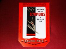 carton publicité porte clef jeux olympiques Grenoble 1968 JO 68 Dauphi noix