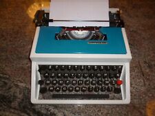 MACHINE A ECRIRE PORTATIVE UNDERWOOD 315 AVEC VALISE ET NOTICE TRES BON ETAT