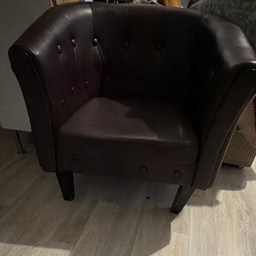 Fauteuil club capitonné cuir