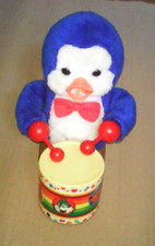 automate jouet pingouin au tambour