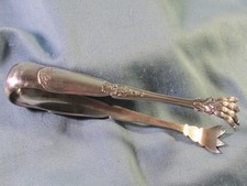 Ancienne belle pince à sucre en métal argenté pattes de lion et feuilles ( N°1)