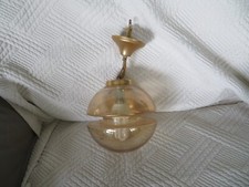 plafonnier globe en verre suspension de style Raak vintage année 60