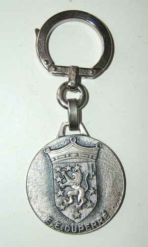 Insigne porte cles escorteur - porte,