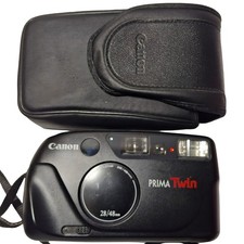Canon Prima Twin Argentique (Non testé). Bel état esthétique + Etui cuir.