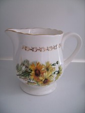 Verseuse/crémier en faïence