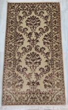 Petit tapis beige noué main