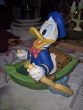 " TIRELIRE DONALD EN BARQUE
