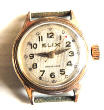 montre ELIX   A REPARER OU