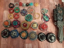 LOT BEYBLADE 11 TOUPIE