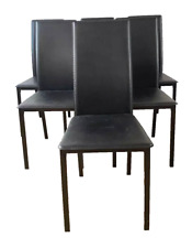 Suite de six chaises en tube laqué et simili cuir noir XX siècle