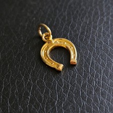 Pendentif porte bonheur fer à