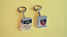 2 ANCIENS PORTE CLÉS AUTOMOBILE BIDON ANTIGEL 96/4 + BIDON RUSTOL TRANSYL