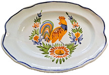 Plat à cul noir en faïence décor coq pour l' époque fin XIXèm