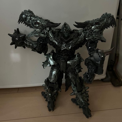 Figurine robot dinosaure gris