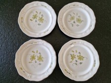 Henriot Quimper Série de 4 assiettes à desserts à décor de fleurs vertes faience