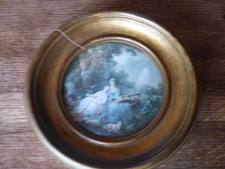 cadre rond en bois doré verre