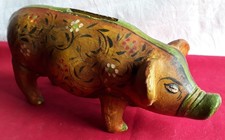 Cochon tirelire en terre cuite