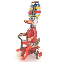 CANARD CLOWN PÉDALANT SUR