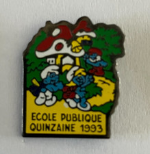 60 - Pin's ECOLE PUBLIQUE QUINZAINE 1993 - VILLAGE DES SCHTROUMPFS - SMURF