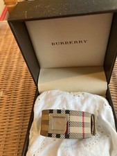 Montre Burberry bracelet tissus tartan beige à l'extérieur ,cuir à l'intérieur,