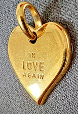 PENDENTIF CŒUR DORÉ YVES SAINT LAURENT.