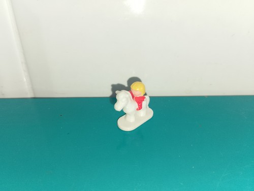 Polly pocket figurine doll
