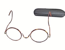 Ancienne paire de lunettes rondes et son boitier en fer des années 1920's