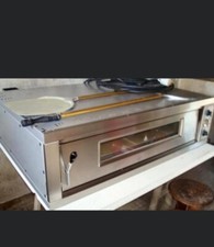 four à pizza électrique état impeccable avec pelle cuisson ultra rapide 