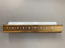 Wall lamp in golden metal